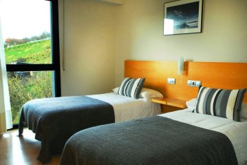 Habitación Twin estandar con 2 cámas y baño privado